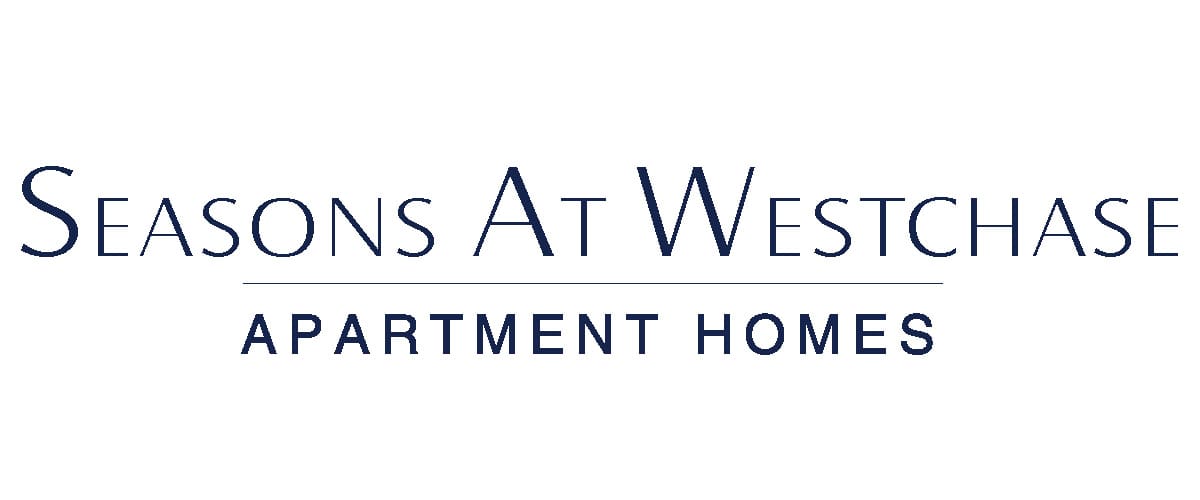 Elegant serif logo in navy blue reading "Seasons At Westchase" with a horizontal line beneath it, followed by "Apartment Homes" in all capital letters.